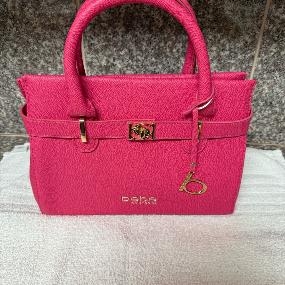Bebe Pink Satchel with Gold Accents and Structured Design